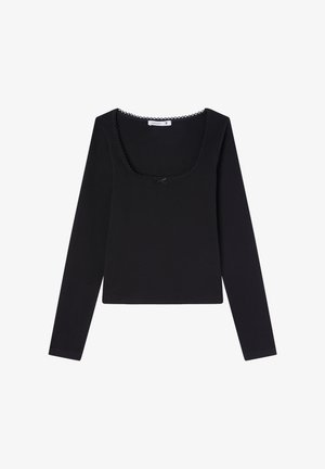 Maglietta nera a maniche lunghe con scollo quadrato, decorata con bordi ondulati e un piccolo fiocco al centro. Tessuto morbido.