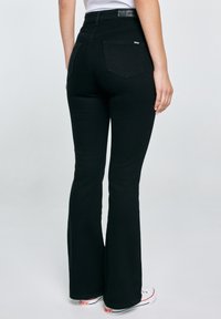 Big Star ADELA  - Bootcut-teksad - schwarz