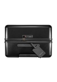 Black hard-shell suitcase with a smooth texture, combination lock, two metal zippers, and a luggage tag attached.