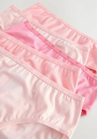 Set of four pairs of women's cotton panties in varying shades of pink, featuring elastic waistbands and a polka dot pattern.