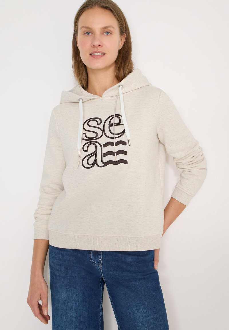 Sweat à capuche beige clair avec cordon de serrage, orné d'un motif imprimé noir « sea ». Confectionné en tissu doux avec poignets et ourlet côtelés.