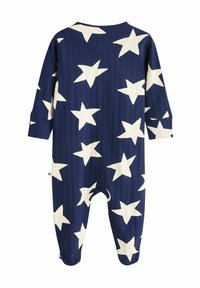 Body en jersey de couleur marine avec un grand motif d'étoiles blanches, manches longues, coupe décontractée, col rond et fermeture à pression à la base.