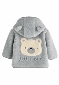 Pelēks vilnas žakets ar lāča sejas plāksteri uz muguras, ar bē�ša akcentiem un "little cub" izšūtu zilā krāsā. Miziņa ar ausīm.