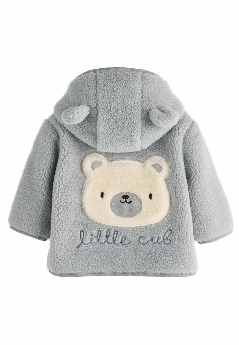 Pelēks vilnas žakets ar lāča sejas plāksteri uz muguras, ar bēša akcentiem un "little cub" izšūtu zilā krāsā. Miziņa ar ausīm.