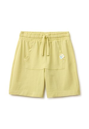 Hellgelbe elastische Shorts mit Kordelzug vorne und großen Vordertaschen, mit einem kleinen bunten Etikett auf der rechten Tasche.