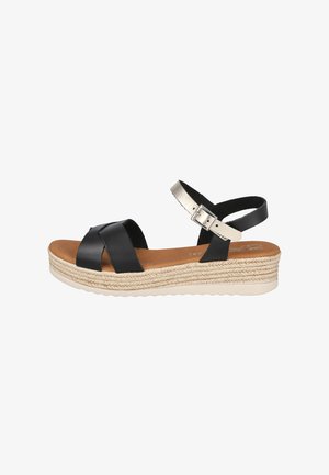 Sandalia de cuña de cuero negro con correa beige en el tobillo, hebilla, plataforma trenzada y plantilla acolchada color marrón claro.