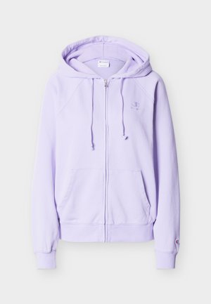 Jasnofioletowa bluza na suwak z kapturem, ze sznurkami, przednimi kieszeniami, ściągaczami przy rękawach oraz małym haftowanym logo na piersi i rękawie.