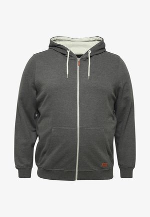 Gray zip-up hoodie made of cotton blend fabric, featuring a drawstring hood, front pockets, and a leather logo patch on the hem.