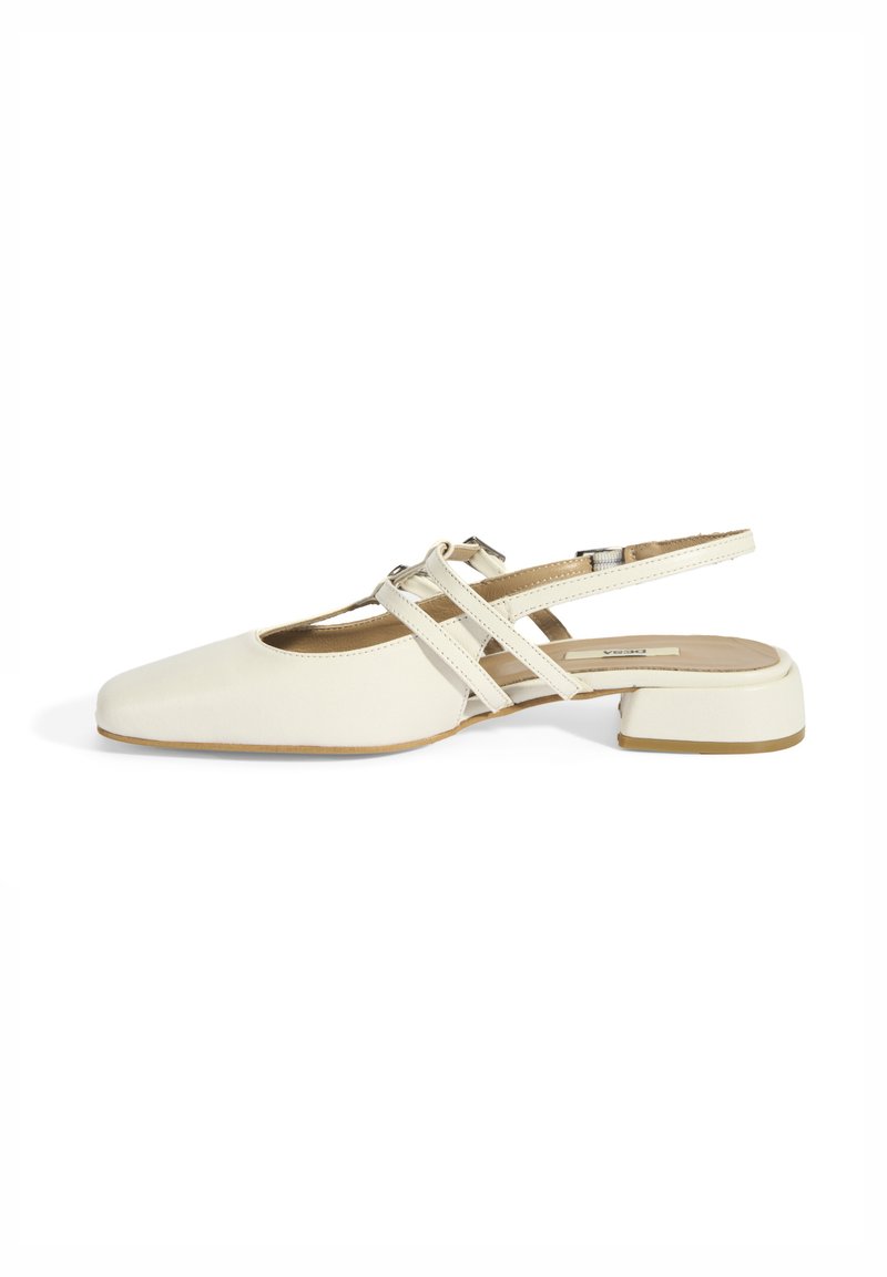 White slingback shoe with a square toe, cross-strap design and a low block heel. Smooth texture and minimalistic aesthetic.