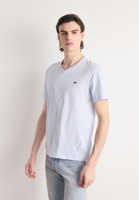 Lacoste - Basic póló - bleu clair Miniatűr kép 1