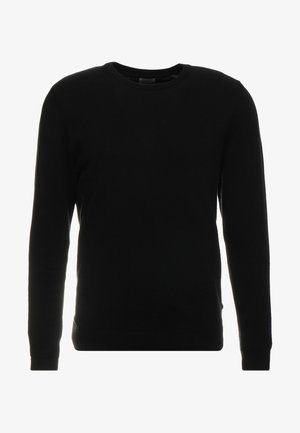 Zwarte pullover trui van zachte stof, met een ronde hals, lange mouwen en geribbelde accenten bij de manchetten en de zoom.