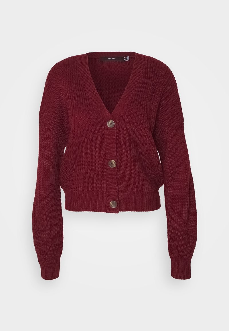 Bordeaux cropped vestje met een diepe V-hals, geribbelde textuur en vier grote bruine knopen aan de voorkant. Lange, brede mouwen.