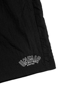 UNFAIR ATHLETICS ELEMENTARY CRUSHED  - Spodnji deli trenirk - black