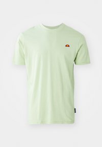 Light green cotton t-shirt featuring a round neckline, short sleeves, and a small embroidered logo in red and yellow on the chest.