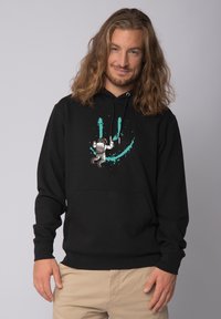 Zwarte hoodie van katoen, met een centraal grafisch ontwerp van een astronaut en turquoise verfsplatters. Inclusief een voorzak en een capuchon met trekkoord.