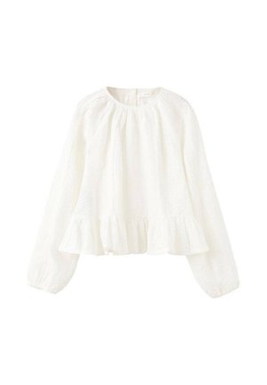 Blouse blanche à manches longues avec ourlet volanté et poignets élastiques. Fabriquée en tissu léger présentant une texture subtile et une coupe ample.