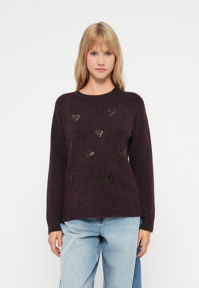 Dark burgundy sweater with a textured finish, featuring shiny heart-shaped sequins scattered across the front, round neckline, and long sleeves.
