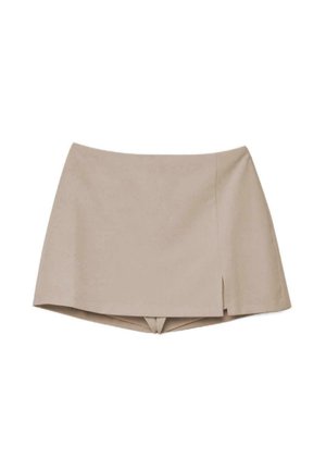 Bež mini suknja sa suptilnim prednjim prorezom i ugrađenim kratkim hlačama ispod, dizajnirana za ležerne ili poluformalna događanja.