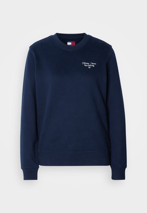 Mørkeblågen genser laget av mykt stoff, med rund hals og lange ermer. Brodert "Tommy Jeans New York City"-logo på brystet.
