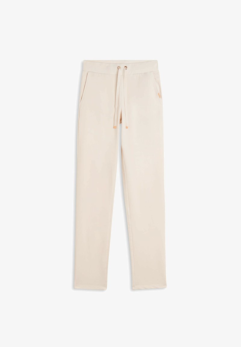 Pantalons de survêtement beiges à taille élastique avec poches avant et cordon de serrage, présentés à plat sur un fond blanc.