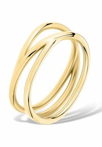 Guldring med två sammanflätade band och en slät, polerad yta. Designen är minimalistisk och flytande, vilket ger ett modernt utseende.