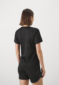 Nike Performance TOP BRANDED - Spordi T-särk - black/metallic gold
