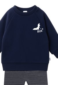 Navy blue sweatshirt with bat and "BOO" graphic; ribbed cuffs. Paired with black and white striped pants. Soft fabric, relaxed fit.
