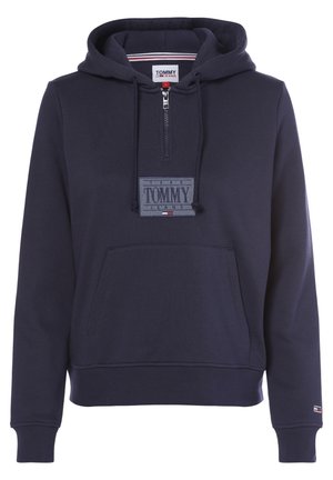 Sweat à capuche bleu marine Tommy Jeans avec fermeture éclair devant, capuche avec cordon, poche kangourou et patch logo sur la poitrine et le bas des manches.
