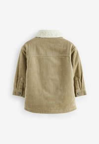 Giacca in corduroy beige con un morbido colletto bianco, caratterizzata da righe verticali, polsini con bottoni e un retro semplice senza tasche.