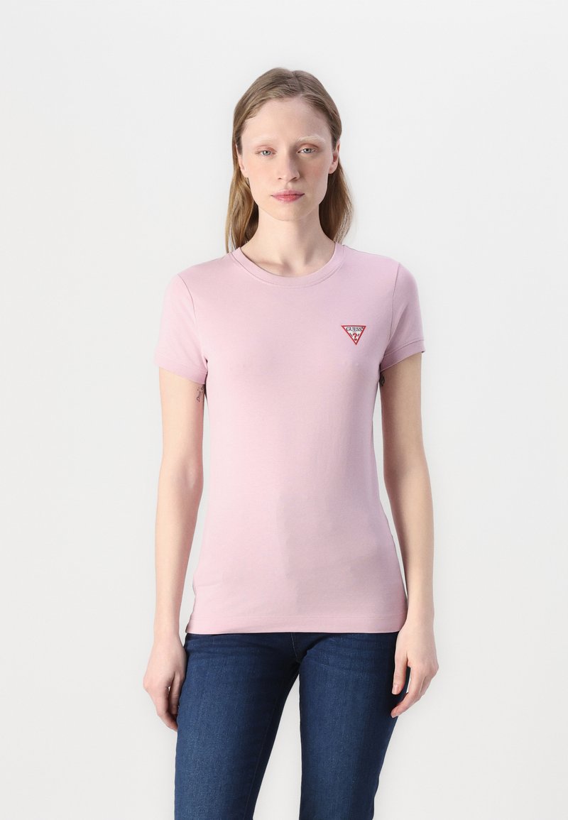 T-shirt di cotone rosa con maniche corte e scollatura rotonda. Presenta una piccola etichetta triangolare sul lato sinistro del petto.