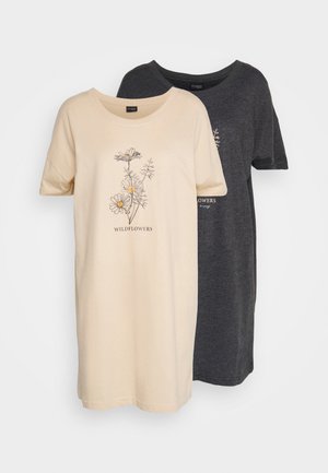 Two short-sleeve T-shirts: one beige with a floral print and text "WILDFLOWERS," and one dark gray, both made of soft fabric.