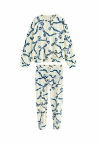 Baumwoll-Loungewear-Set mit einem blauen abstrakten Muster auf einem cremefarbenen Hintergrund, bestehend aus einem lässigen Sweatshirt und schmal zulaufenden Hosen.