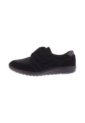 Black shoes with a velcro strap, featuring a combination of matte and textured suede materials, a rounded toe, and a textured rubber sole.