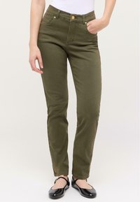 Olivově zelené denimové kalhoty s úzkým střihem, s předními kapsami, knoflíkovým zapínáním a švy s detailemi šití.