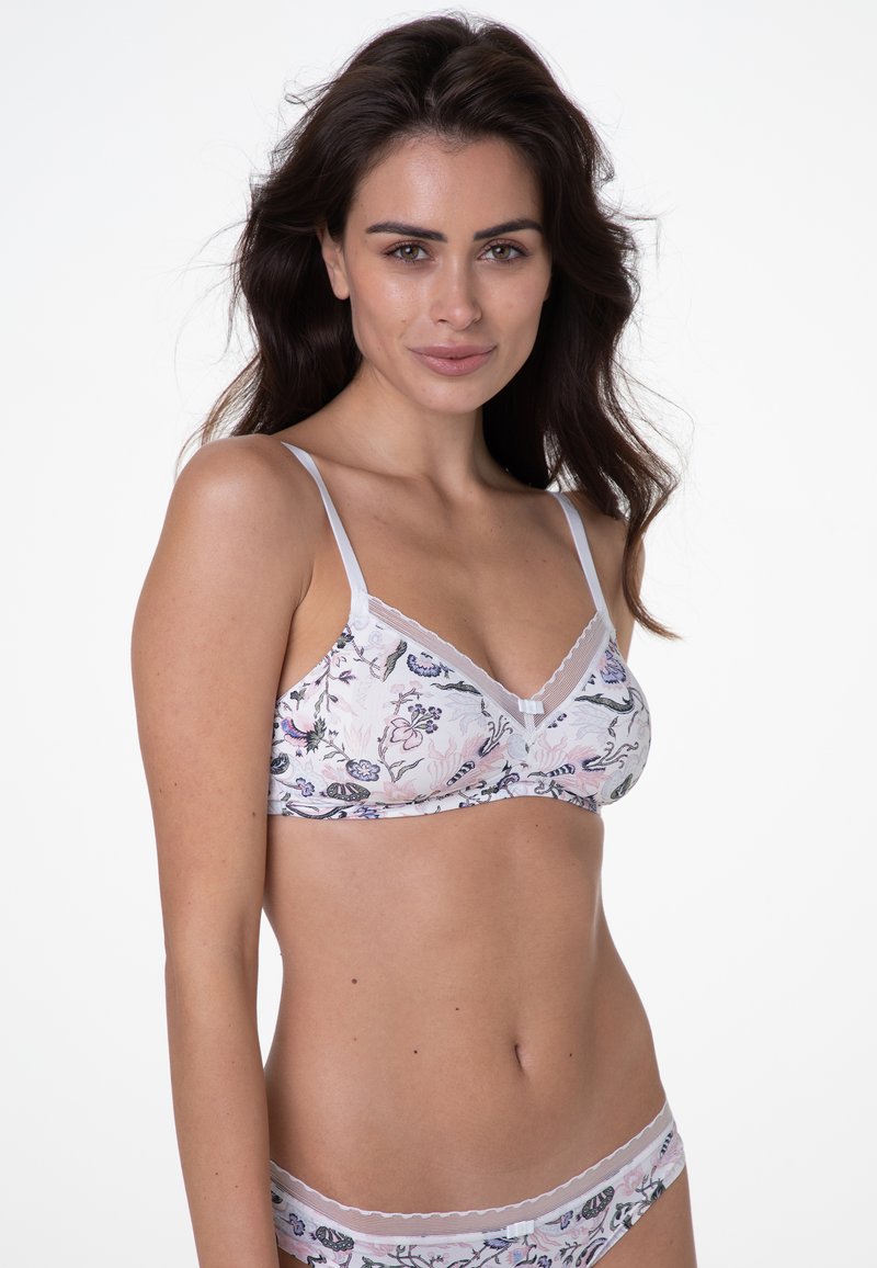 Bralette con motivo floreale in tessuto morbido e leggero; sfondo rosa, rifinitura in pizzo bianco, spalline regolabili e lieve arricciatura nelle coppe.