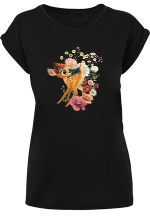 Svart T-shirt med rundhals, med en grafik av en hjort omgiven av färgglada blommor, som visar detaljerade texturer och livfulla färger.