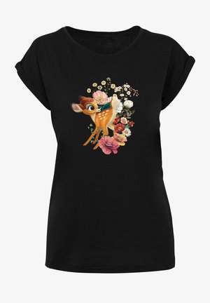 Svart T-shirt med rundhals, med en grafik av en hjort omgiven av färgglada blommor, som visar detaljerade texturer och livfulla färger.