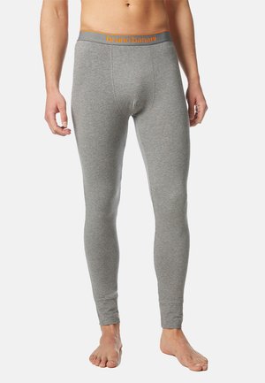 Helle graue Leggings aus weichem, elastischem Material. Sie verfügen über einen elastischen Bund mit "bruno banani" in orangefarbener Schrift.