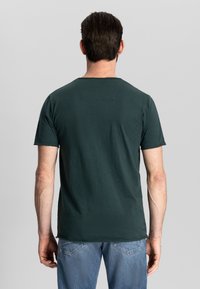 Men's Oversized McQueen T-Shirt in White | McQueen US
