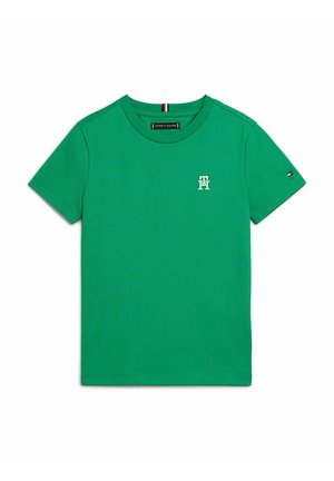 Zielona krótka koszulka Tommy Hilfiger z małym białym logo TH na piersi oraz małym logo flagi na lewym rękawie.