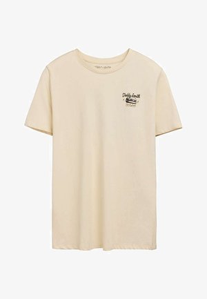 T-shirt beige à manches courtes avec col rond et petit logo graphique noir lisant « Teddy Smith » sur le côté gauche de la poitrine.