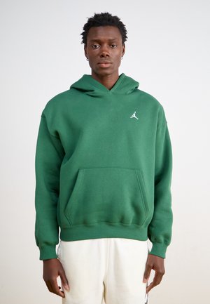 Felpa verde realizzata in materiale morbido, con tasca a marsupio, polsini a coste e il logo di Air Jordan in bianco sul lato sinistro del petto.