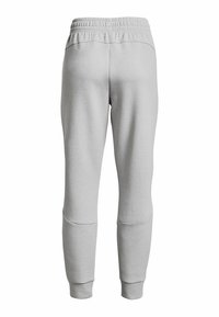 Pantalons de survêtement gris en tissu doux, avec une taille élastique, des jambes fuselées et des panneaux aux genoux d'une texture lisse.