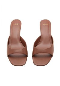 Brown faux leather slide sandals with a wide upper strap, open toe, and flat sole. MNG logo embossed in gold on the footbed.