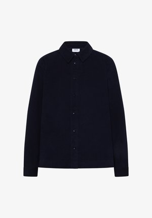 Navyblauwe overhemdbloes van corduroy stof met lange mouwen en een klassieke kraag, voorzien van zwarte knopen aan de voorkant.