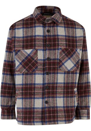 Chemise en flanelle à carreaux dans des teintes de bordeaux, crème et bleu. Dotée de deux poches poitrine, d'une fermeture à boutons et d'un col structuré. Tissu texturé.