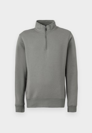 Grå pullover sweatshirt med en halv lynlås-krave, ribbede manchetter og en lige kant. Fremstillet af blødt stof med en glat overflade.