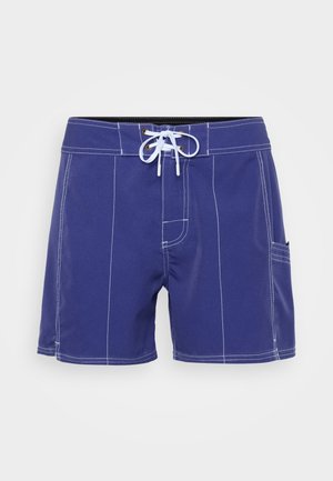 Terry cloth swim shorts, blue with white stitching, elastic waistband with drawstring, side pocket. Casual design, knee-length cut.