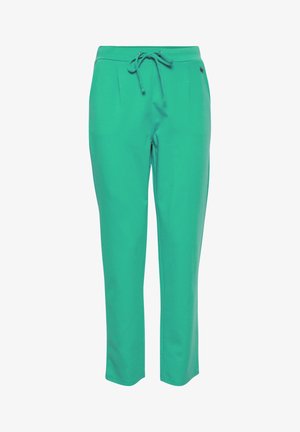 Roheline, pehme kangast püksid, millel on reguleeritav vöökoht, kitsenevad jalad ja kaks esistantsi. Materjalil on sile tekstuur ja puhas viimistlus.