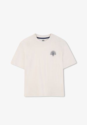 Light beige cotton t-shirt with a round neckline. Features a small navy graphic logo on the left chest area. Short sleeves, relaxed fit.